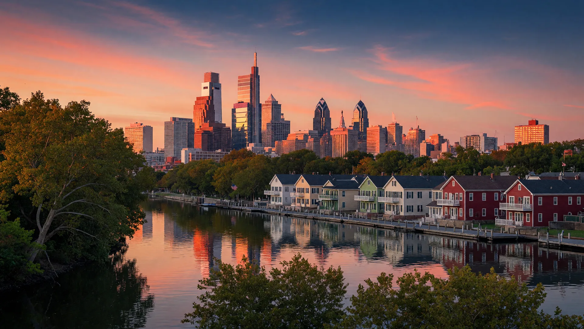 Philadelphia skyline at golden hour with Boathouse Row reflected in the Schuylkill River