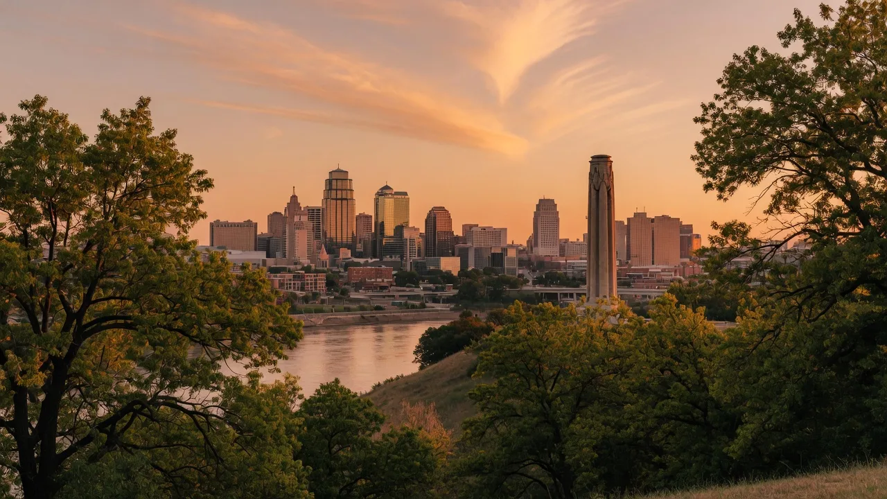 Kansas City skyline at golden hour with Liberty Memorial silhouette