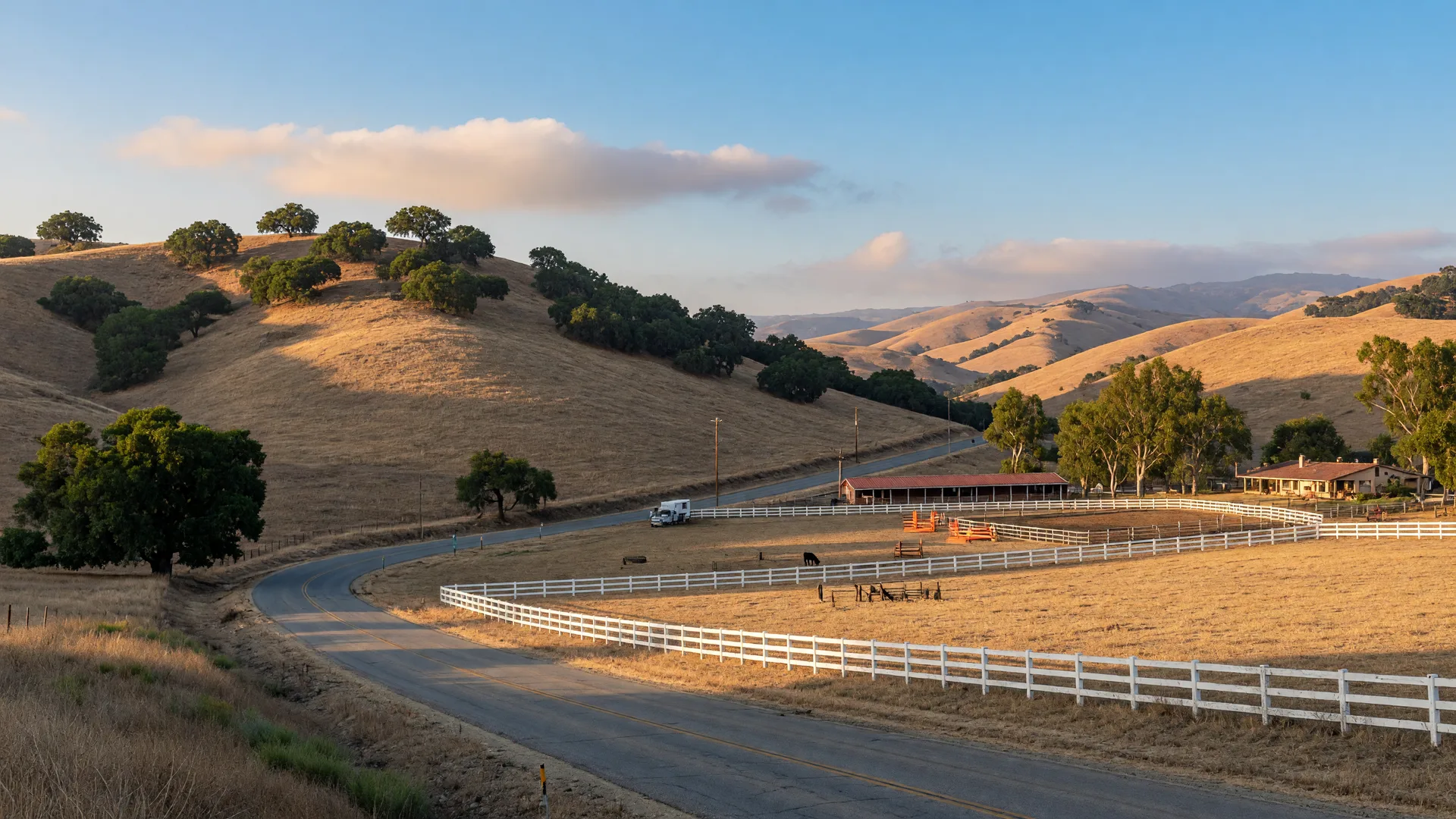 Rolling golden hills and open ranch land with a quiet road in the semi-rural countryside around Wildomar, California