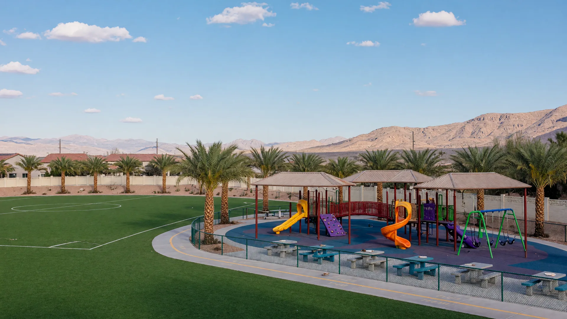 Neighborhood park in a Las Vegas master-planned community with a playground and ramadas at the base of desert mountains