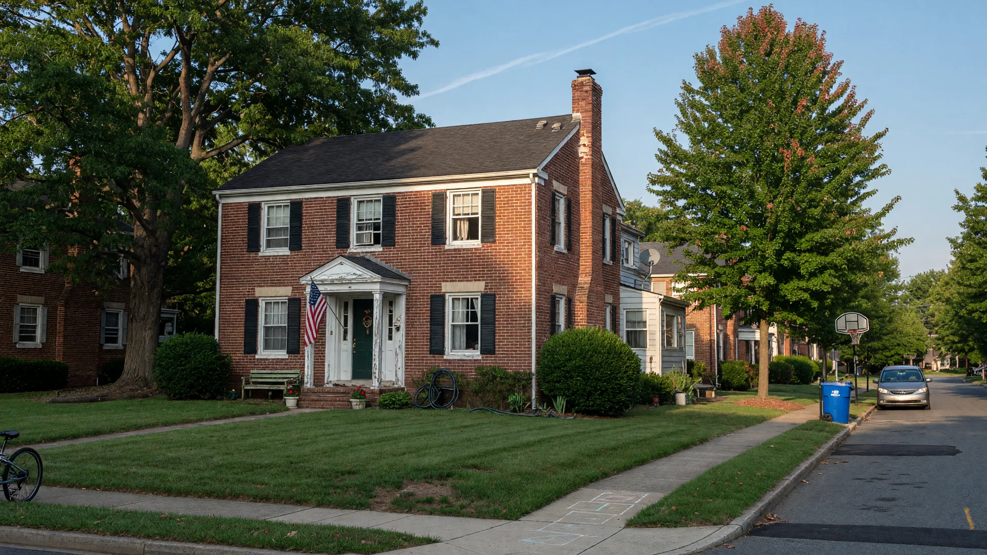 A brick-front Maryland colonial home on a quiet tree-lined street representing the type of probate property a Personal Representative may need to sell