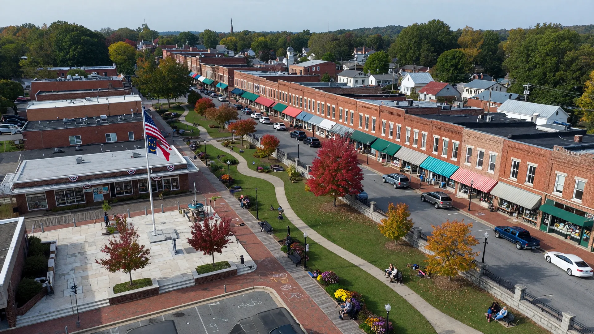 Aerial shot of Downtown Holly Springs NC featuring local shops, greenways, and civic centers
