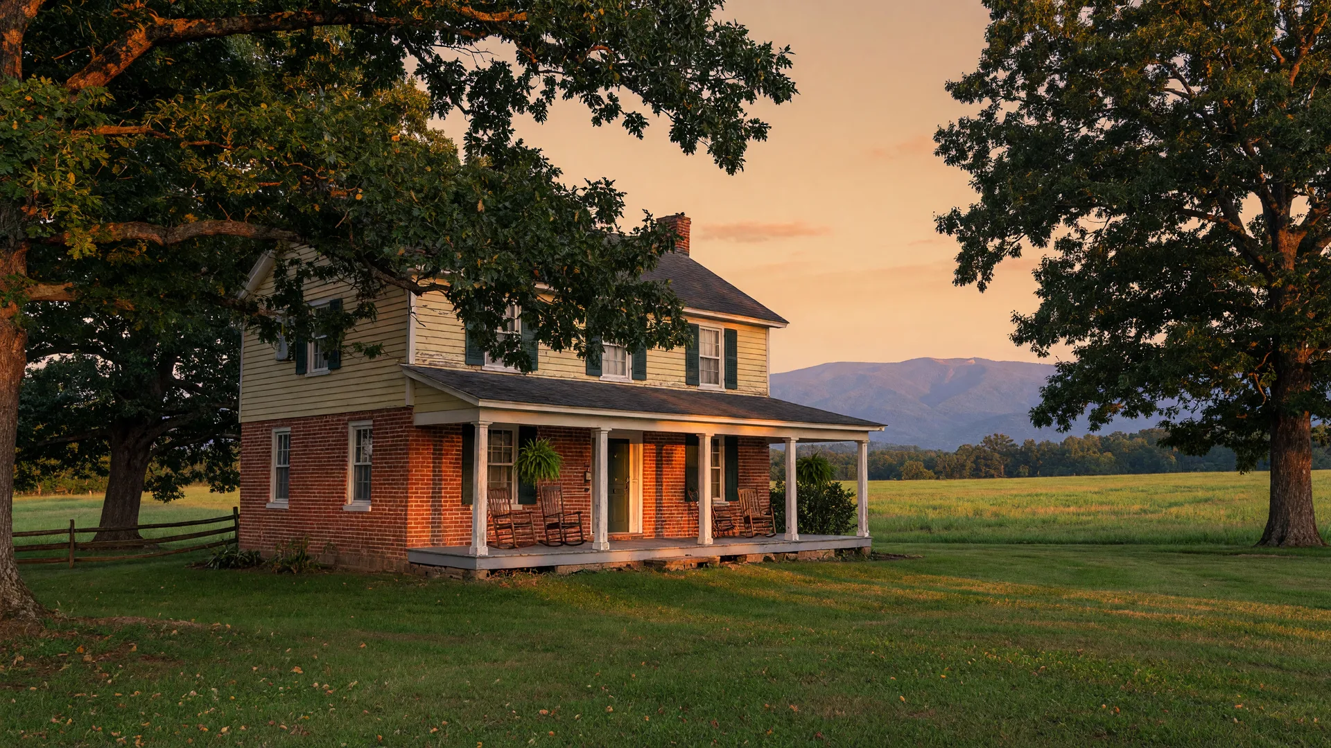 A traditional brick and siding home in the Virginia Piedmont countryside at golden hour