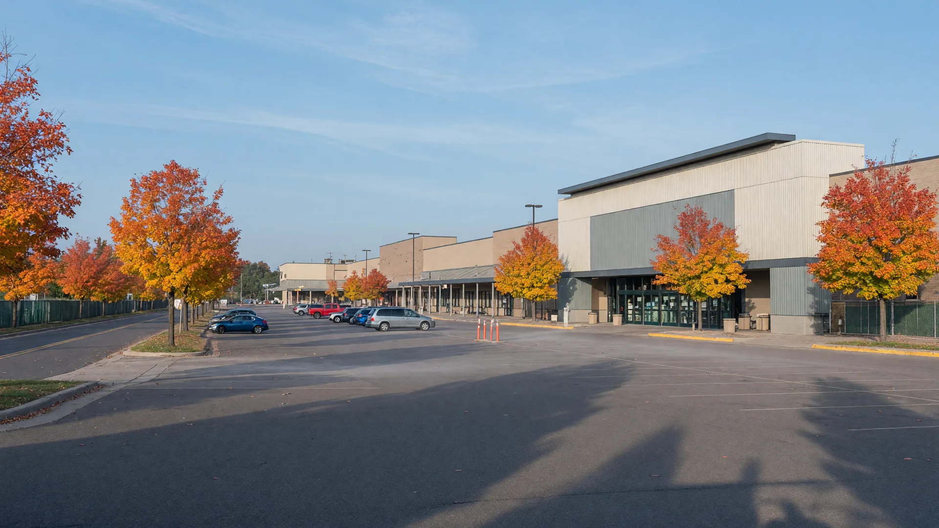 Westgate Mall style retail complex in Baxter on a crisp autumn morning with fall trees and a clear sky