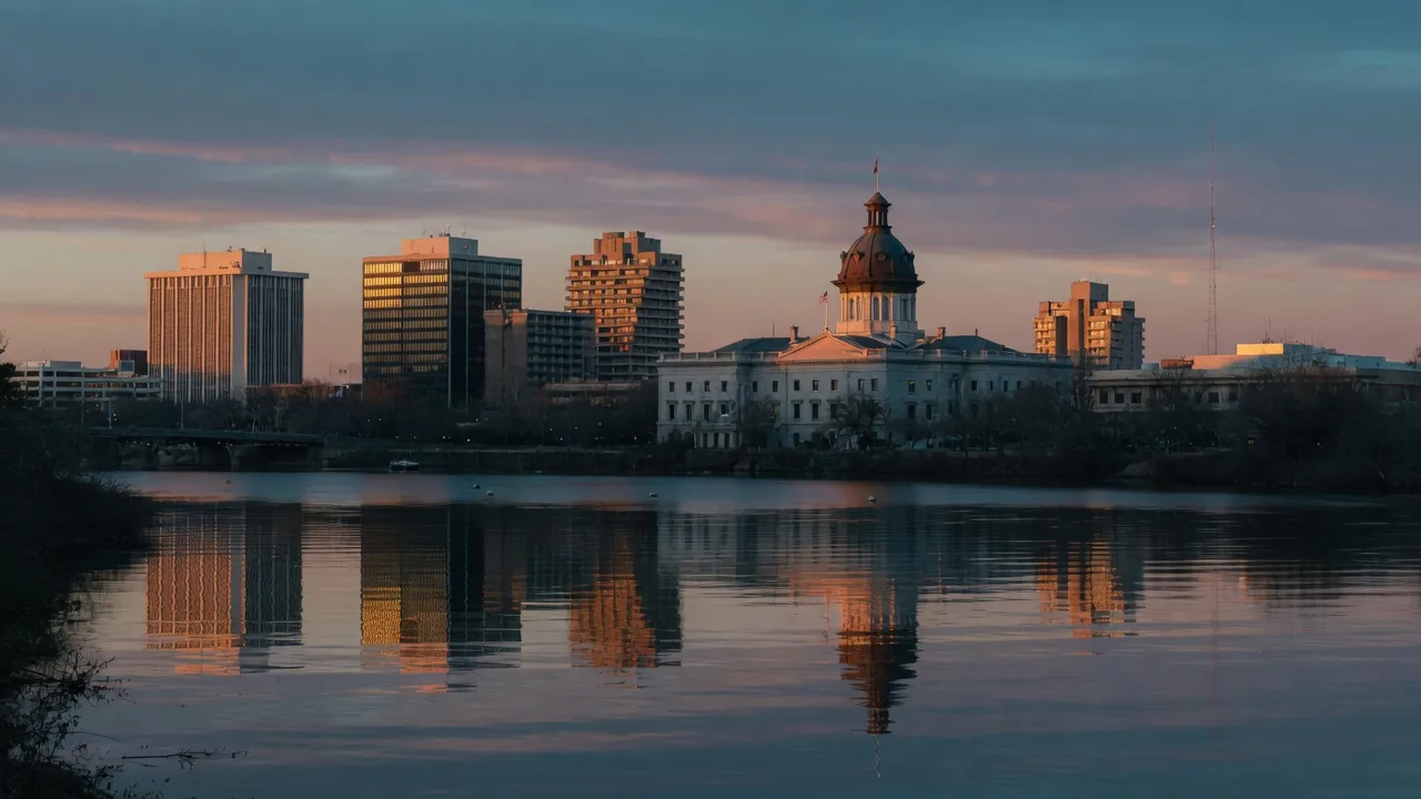 Downtown Columbia, SC skyline at dusk with the State House dome