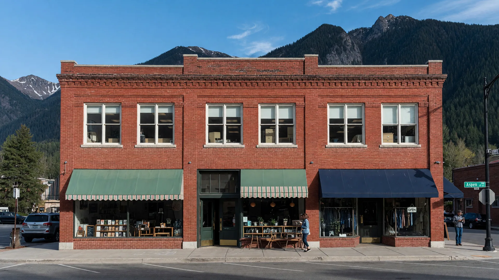 Brick commercial mixed-use building with storefronts and offices above in a Flagstaff mountain downtown