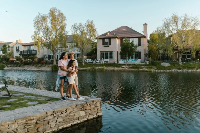 Family enjoying a lake view in a residential community
