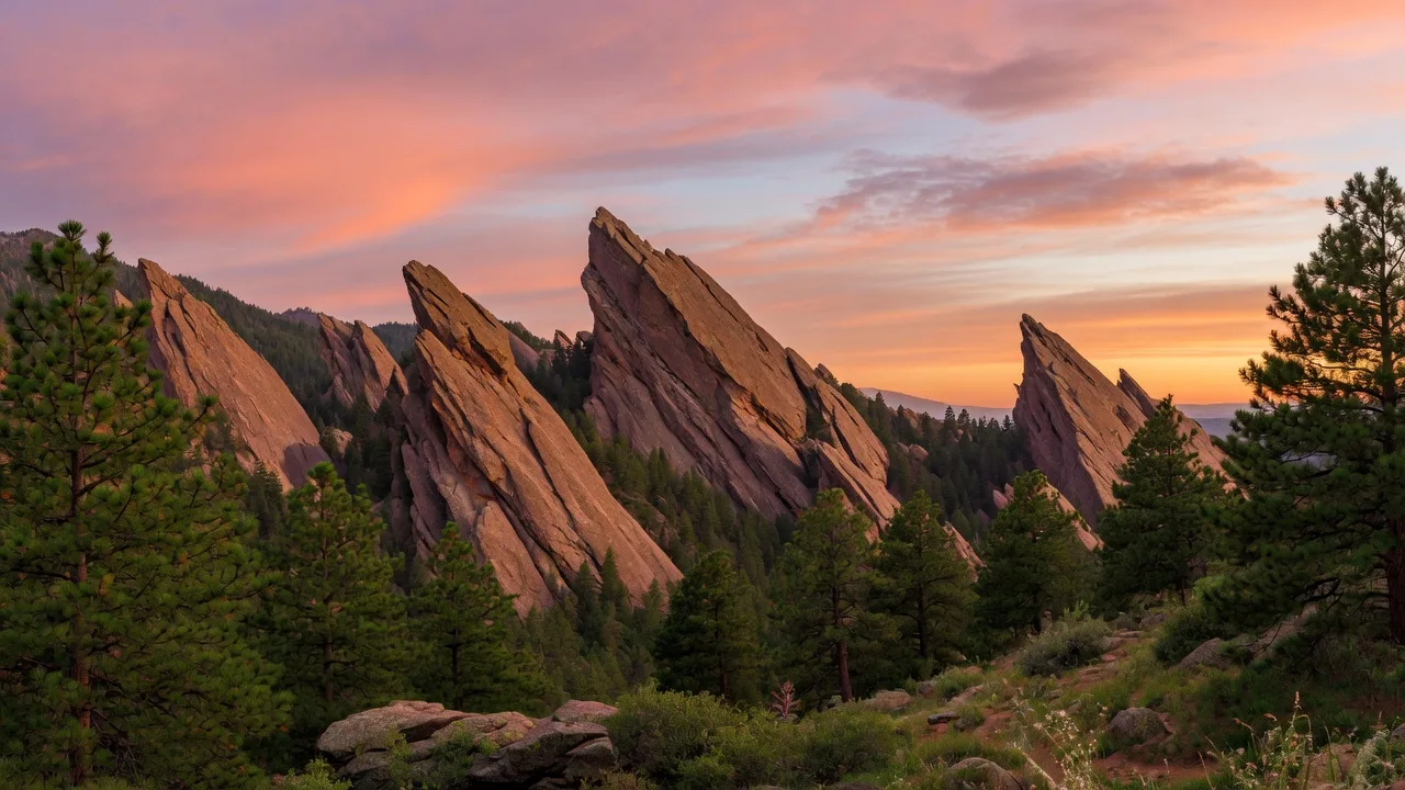 The Flatirons mountain range at sunrise in Boulder Colorado