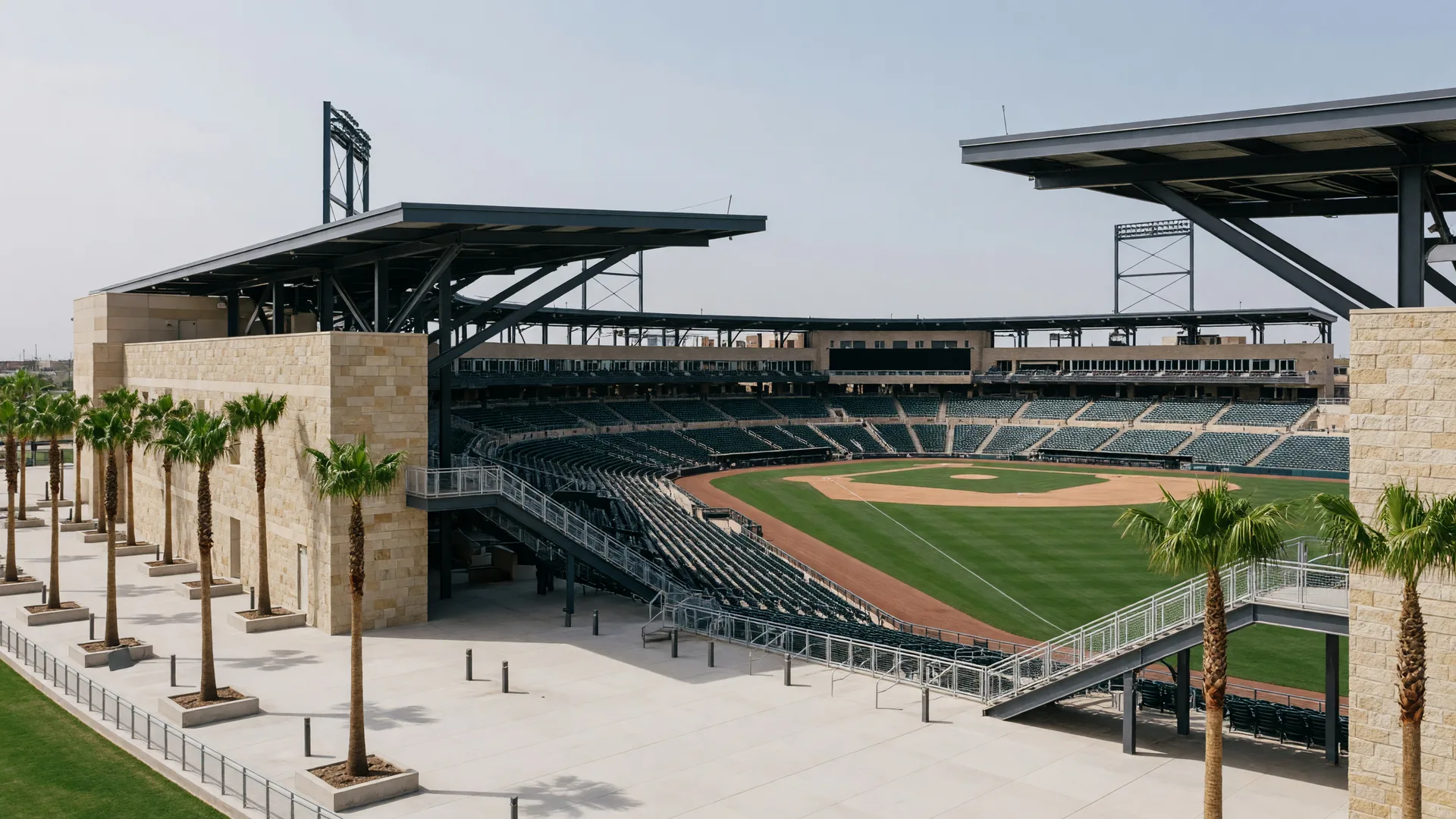 Surprise Stadium spring training ballpark at golden hour with palm trees and green practice fields