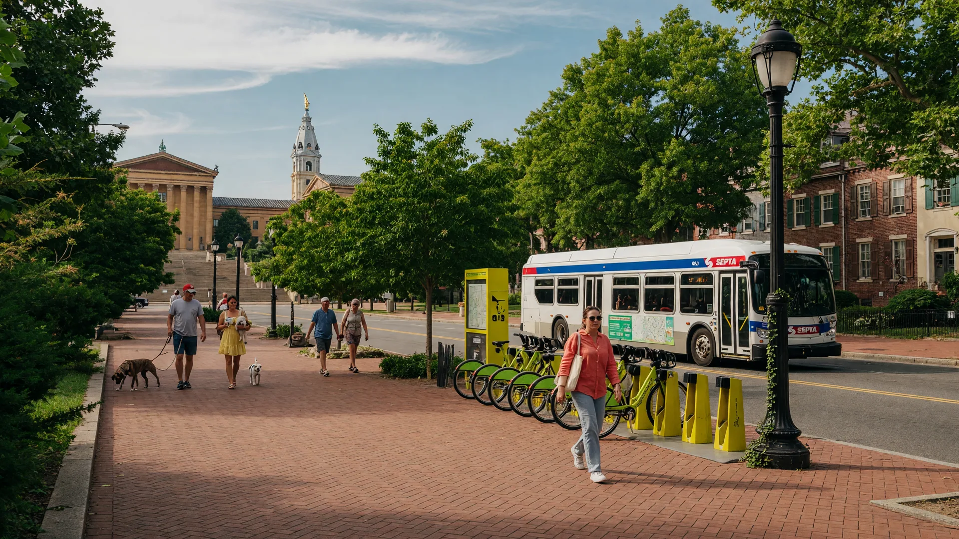 Fairmount Philadelphia street scene with pedestrians, cyclists, and SEPTA transit on a sunny day