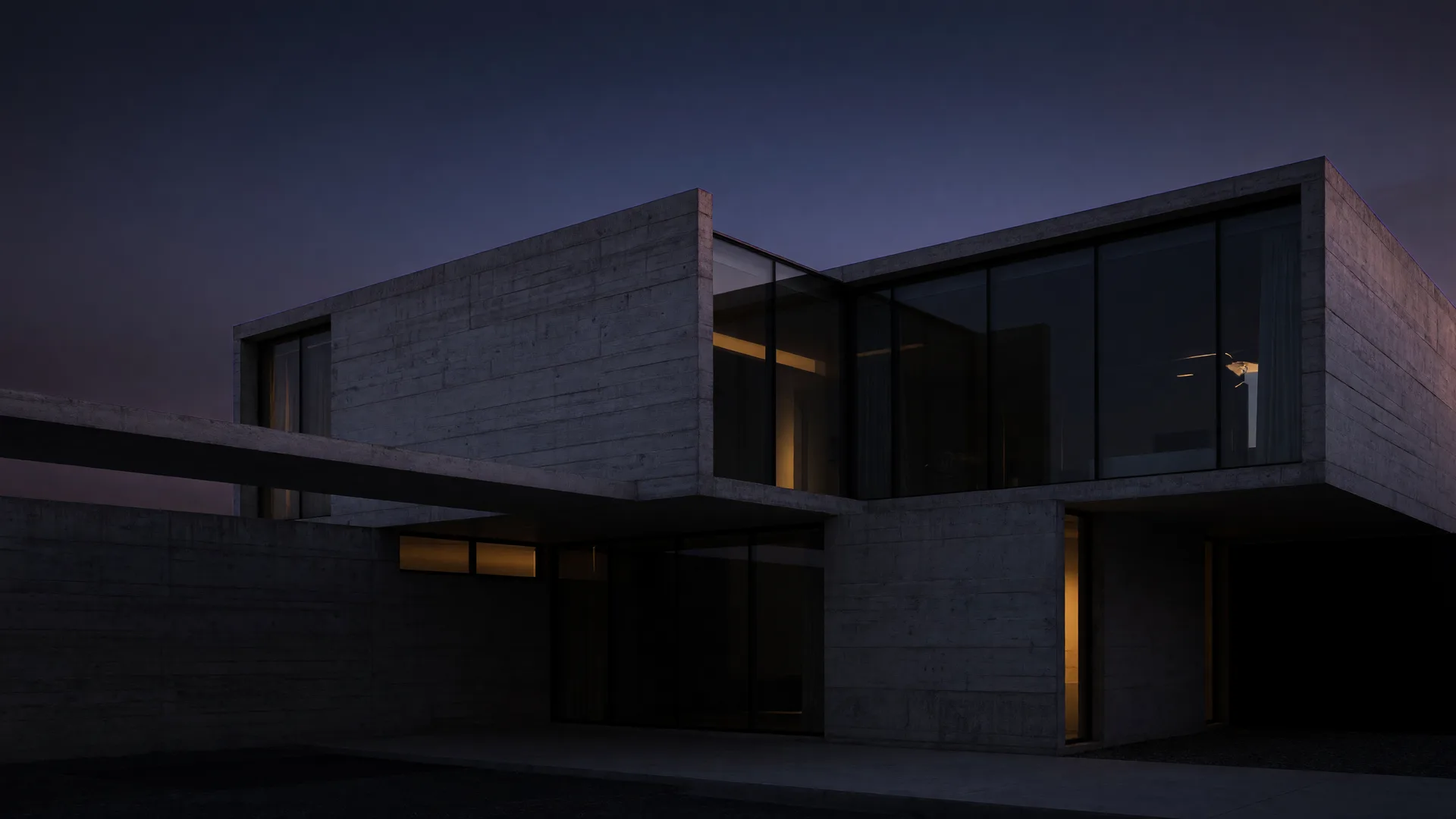 Low-key architectural photograph of a modern concrete-and-glass home at dusk with warm interior light