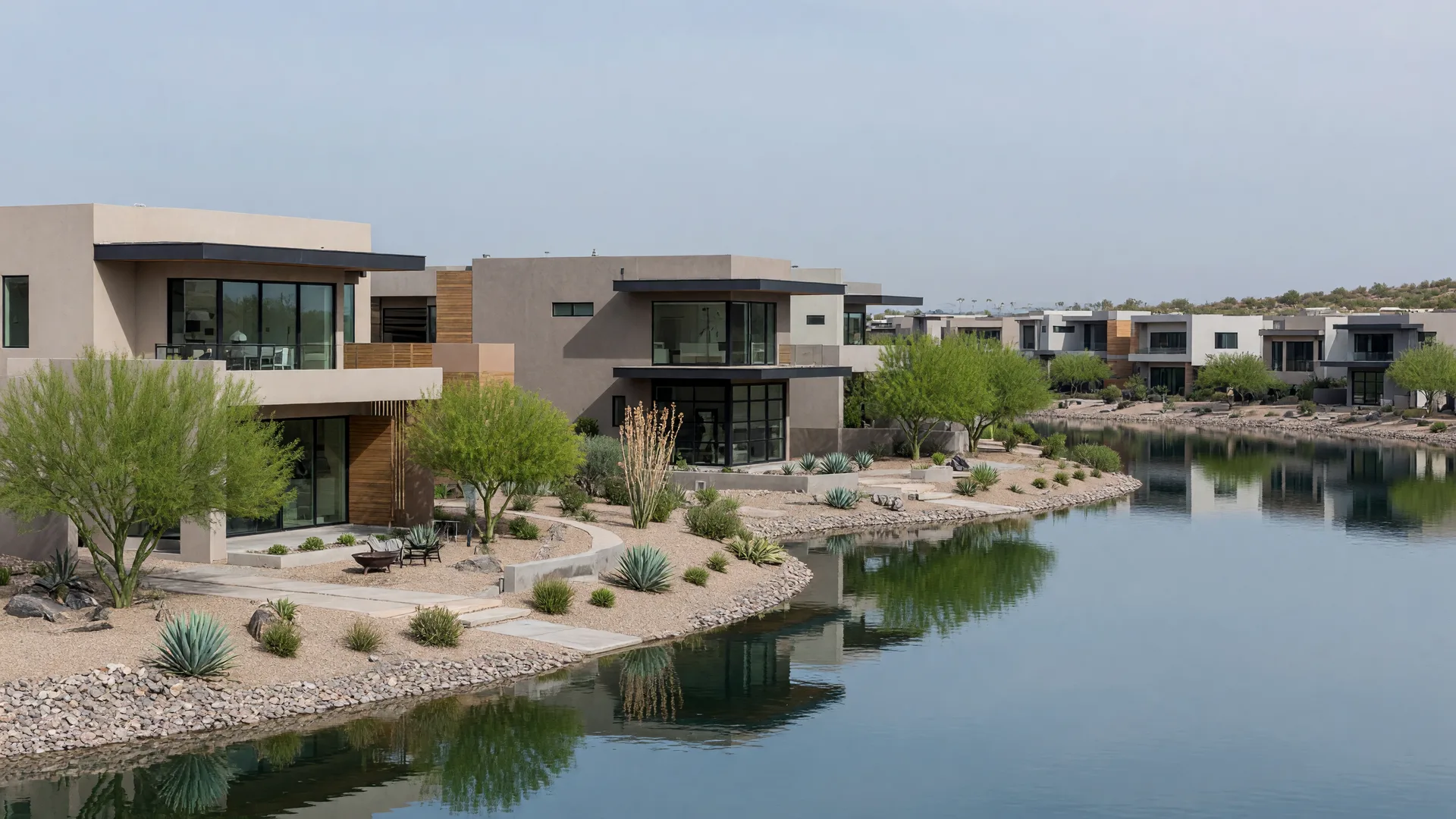 Modern master-planned community lake in Mesa reflecting new homes at dusk