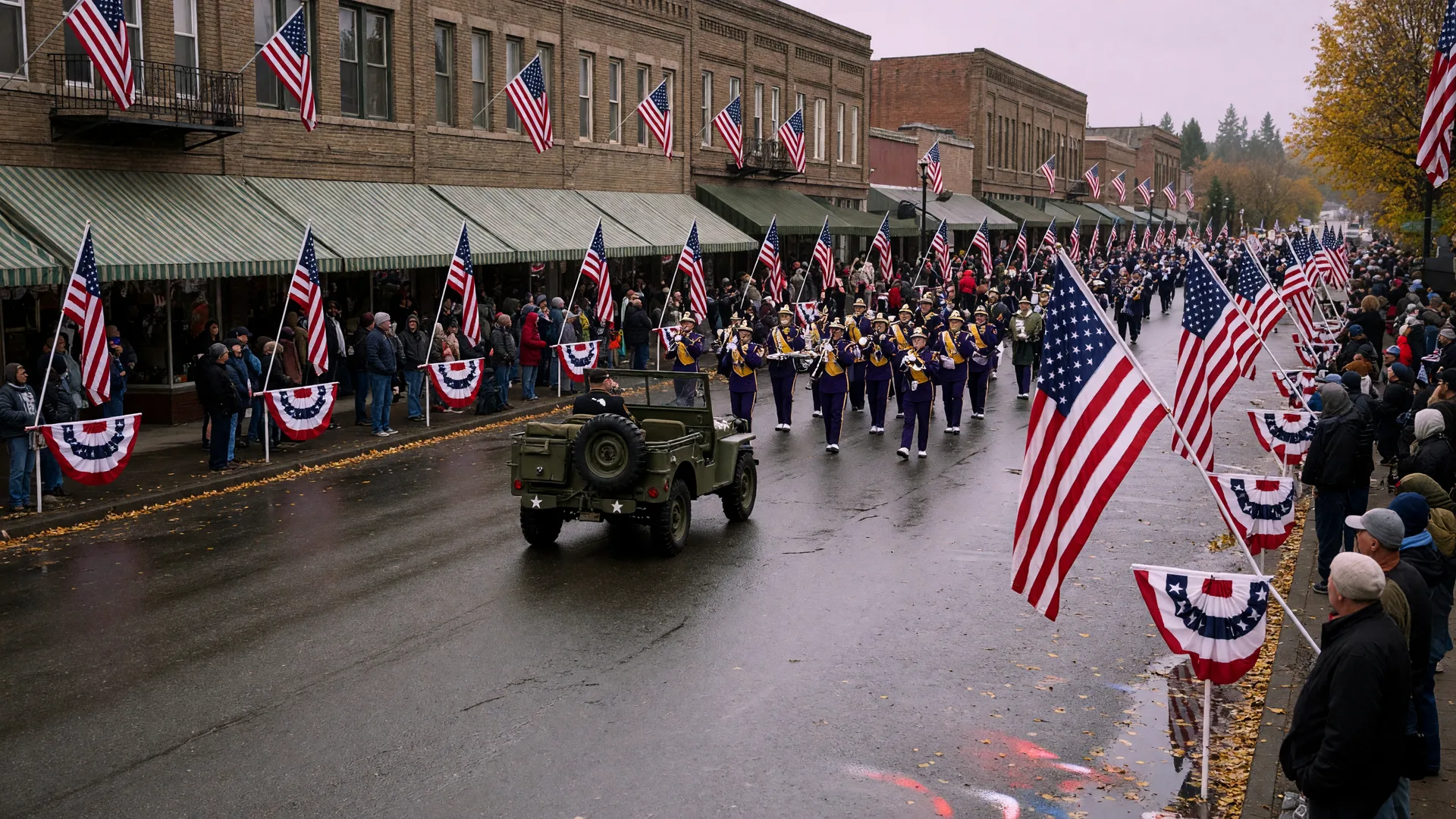 American flags and autumn storefronts lining a historic downtown Oregon street ahead of the Linn County Veterans Day Parade