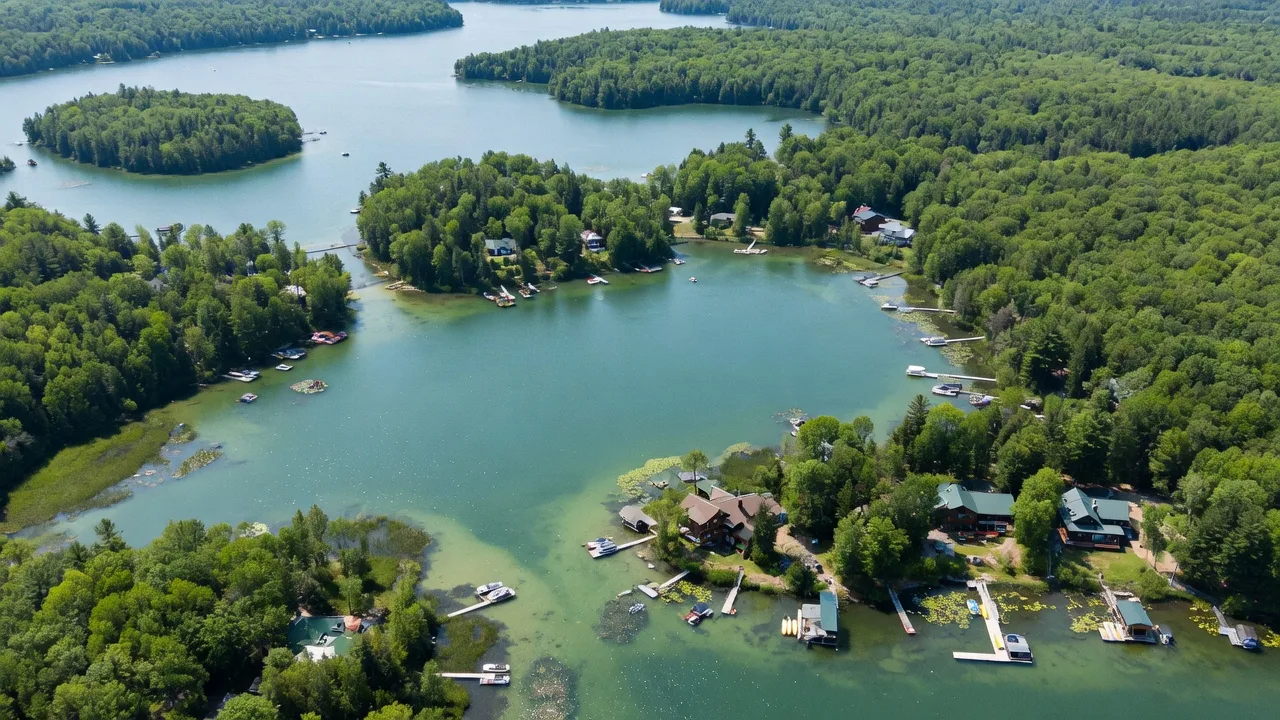Aerial view of Minnesota lake chain with forested shorelines