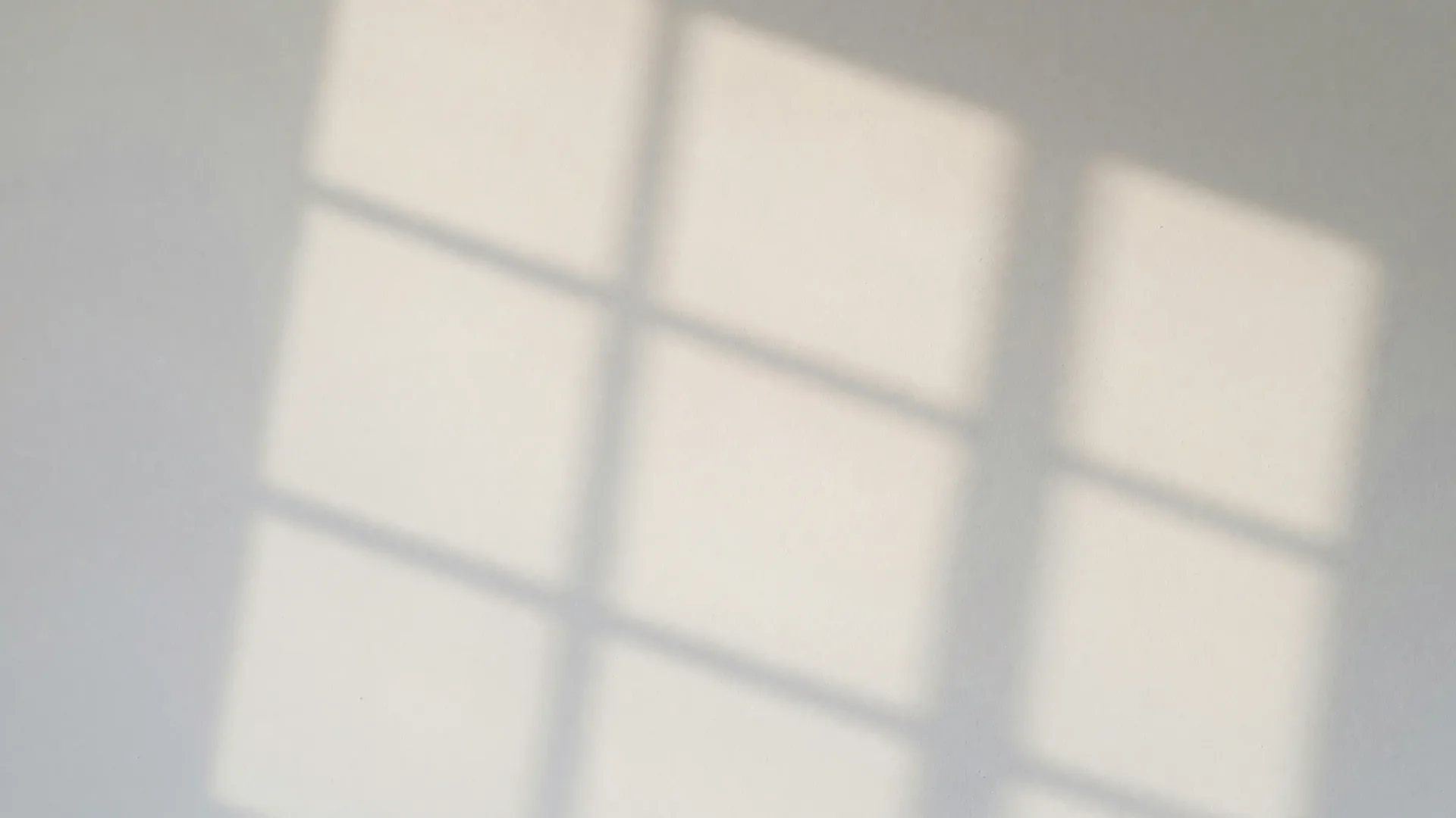 Clean daylight across a freshly painted wall