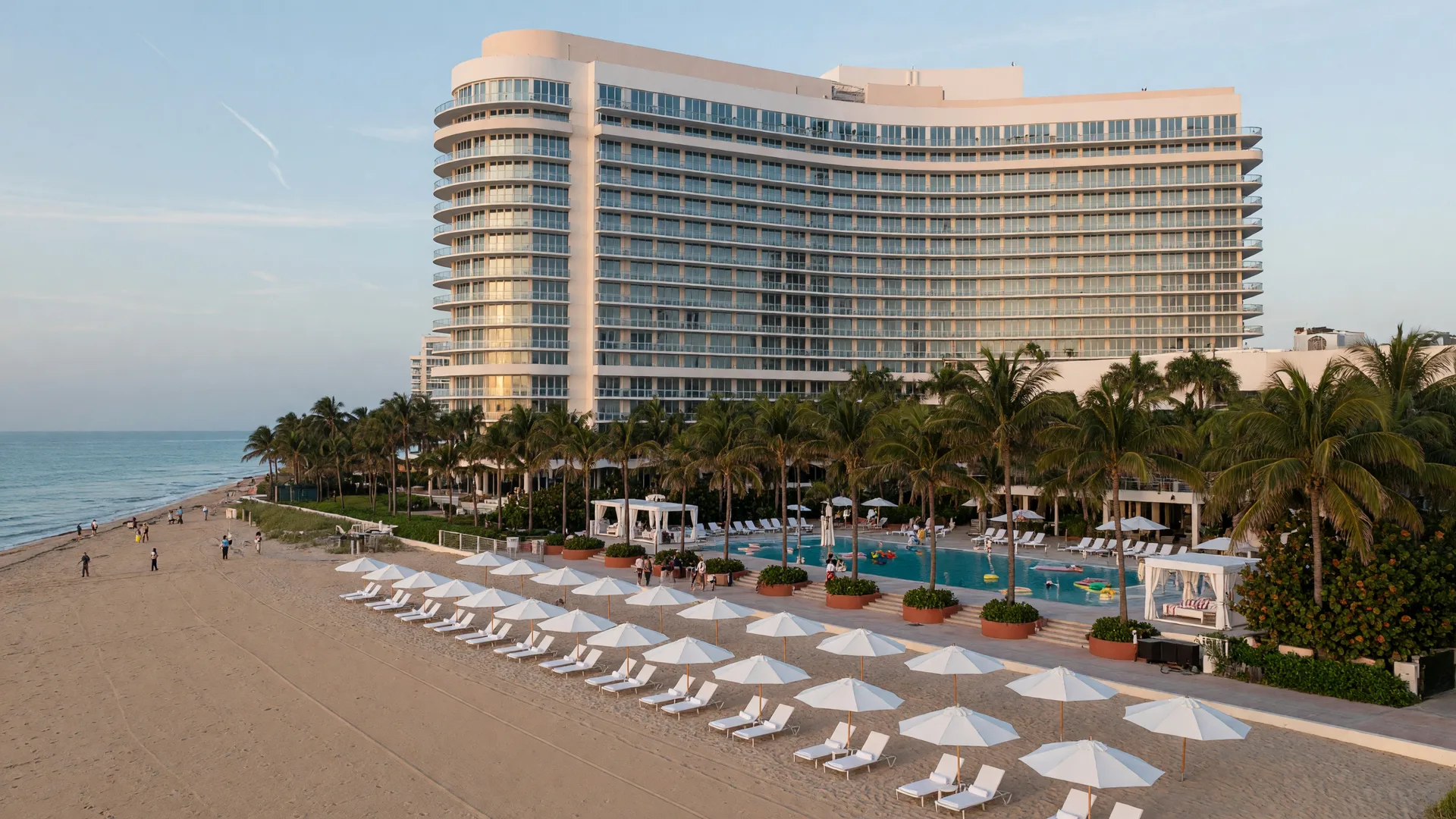 The Diplomat Beach Resort in Hollywood, Florida on the morning of Day 2 of the Mike Ferry 2026 Superstar Retreat, the curved oceanfront tower rising behind the palm-lined pool deck and the Atlantic beach