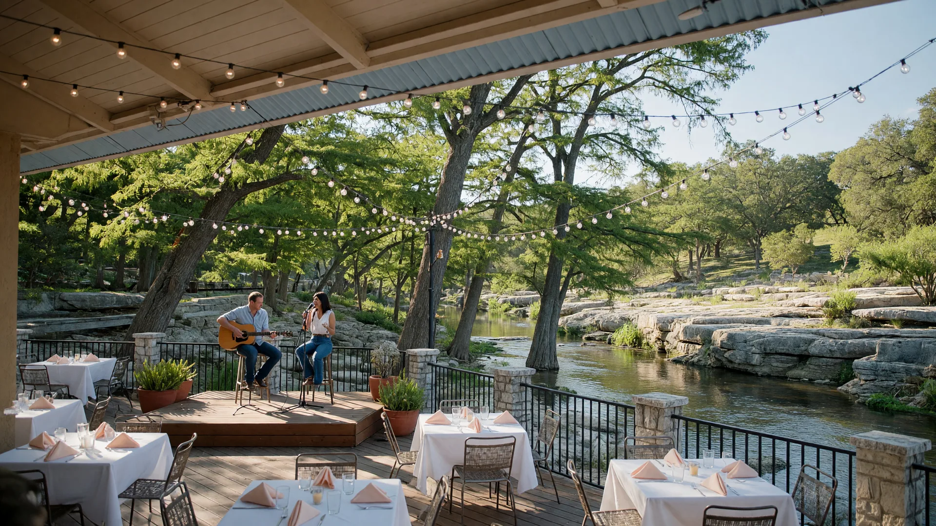 Live acoustic music on the creekside patio at Creekhouse Kitchen & Bar in Wimberley