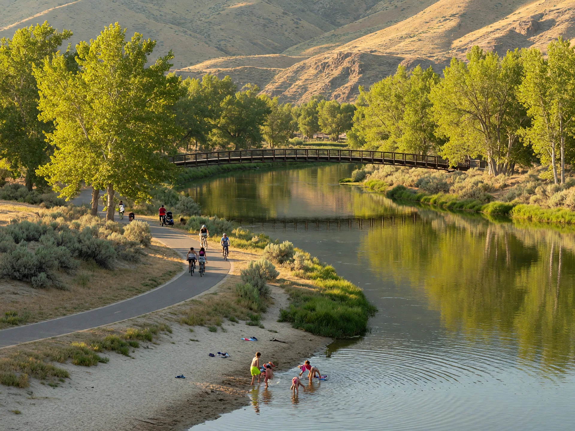 The Boise River Greenbelt at golden hour with people strolling along the path