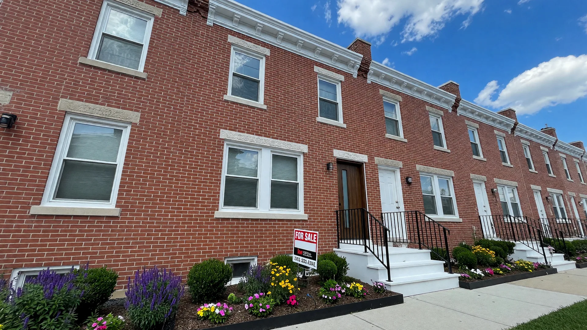 Renovated Philadelphia rowhome in Point Breeze with modern finishes and for sale sign