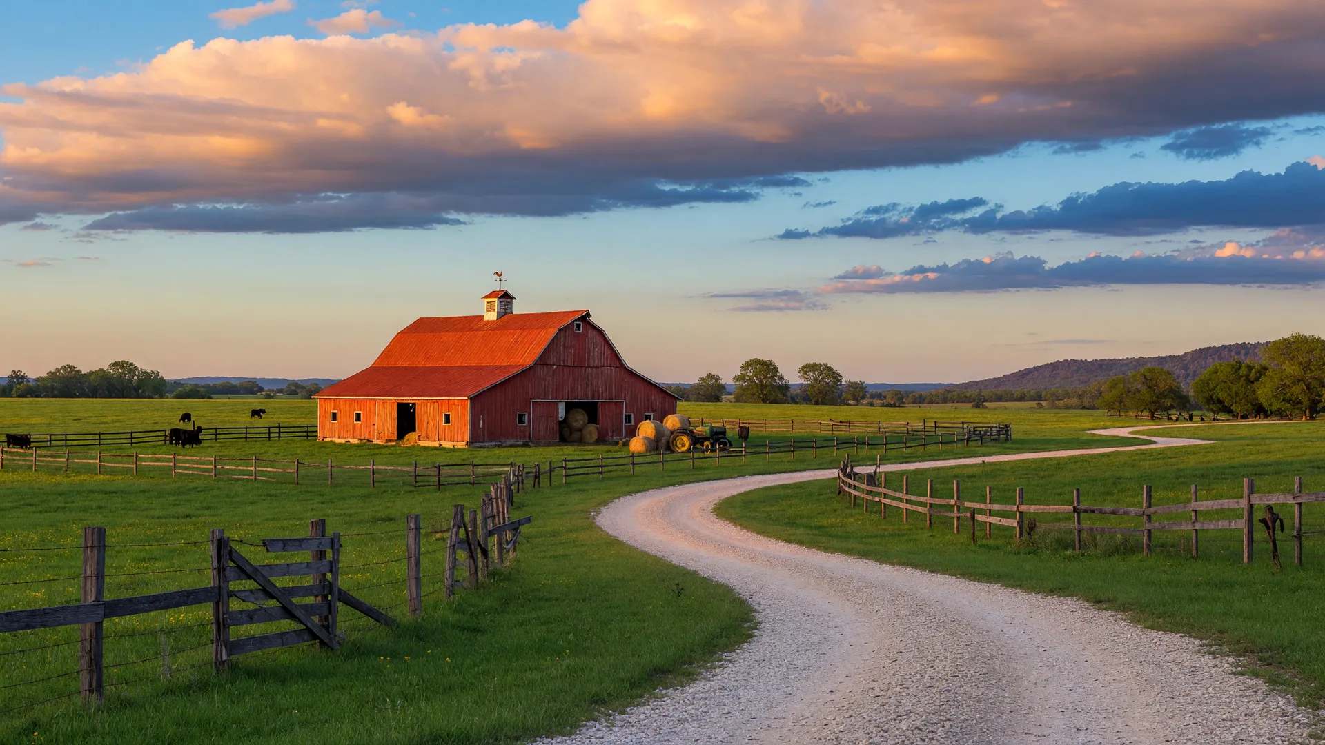 Rural farmland in Northeast Texas at golden hour with a red barn, wooden fences, and a winding gravel road through green pastures