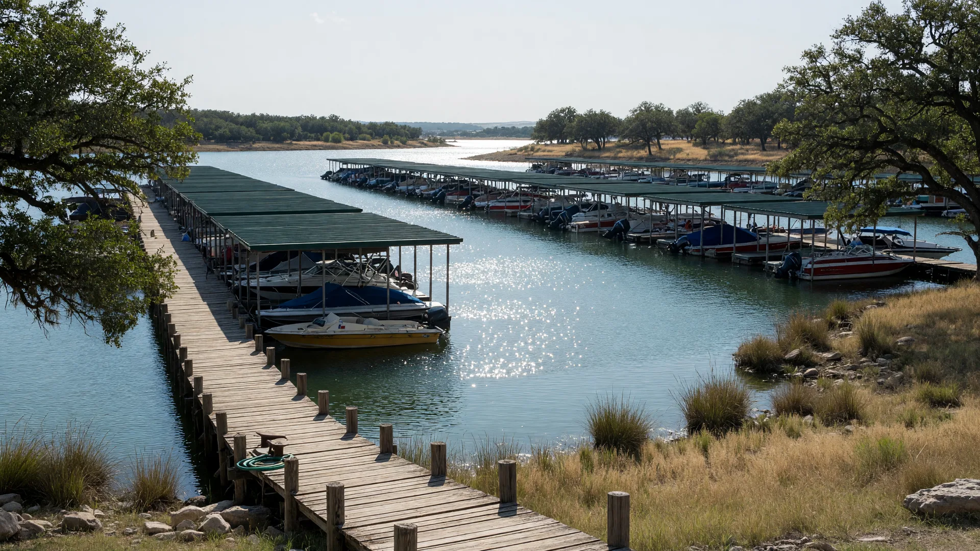 Boats in covered slips at a Lake Texoma marina near Pottsboro, Texas on a bright day