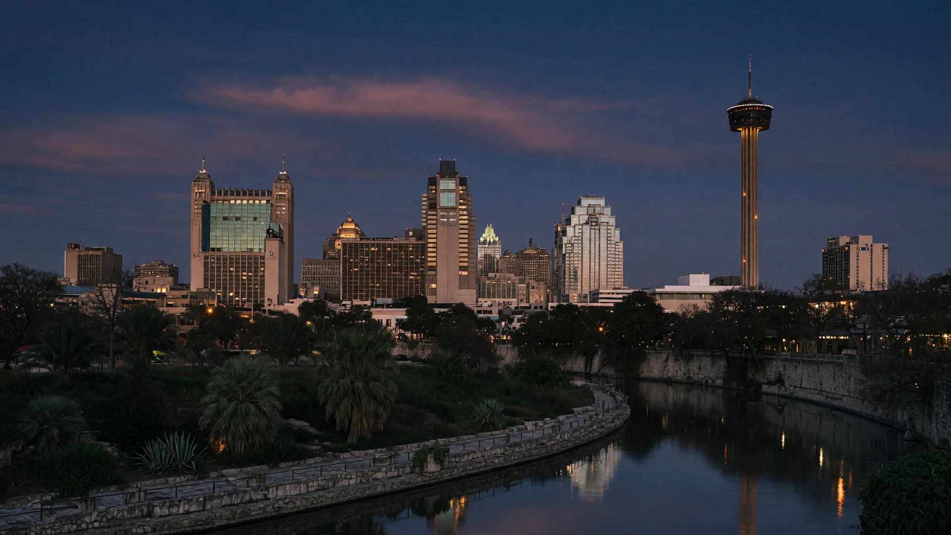The San Antonio skyline at dusk over the river