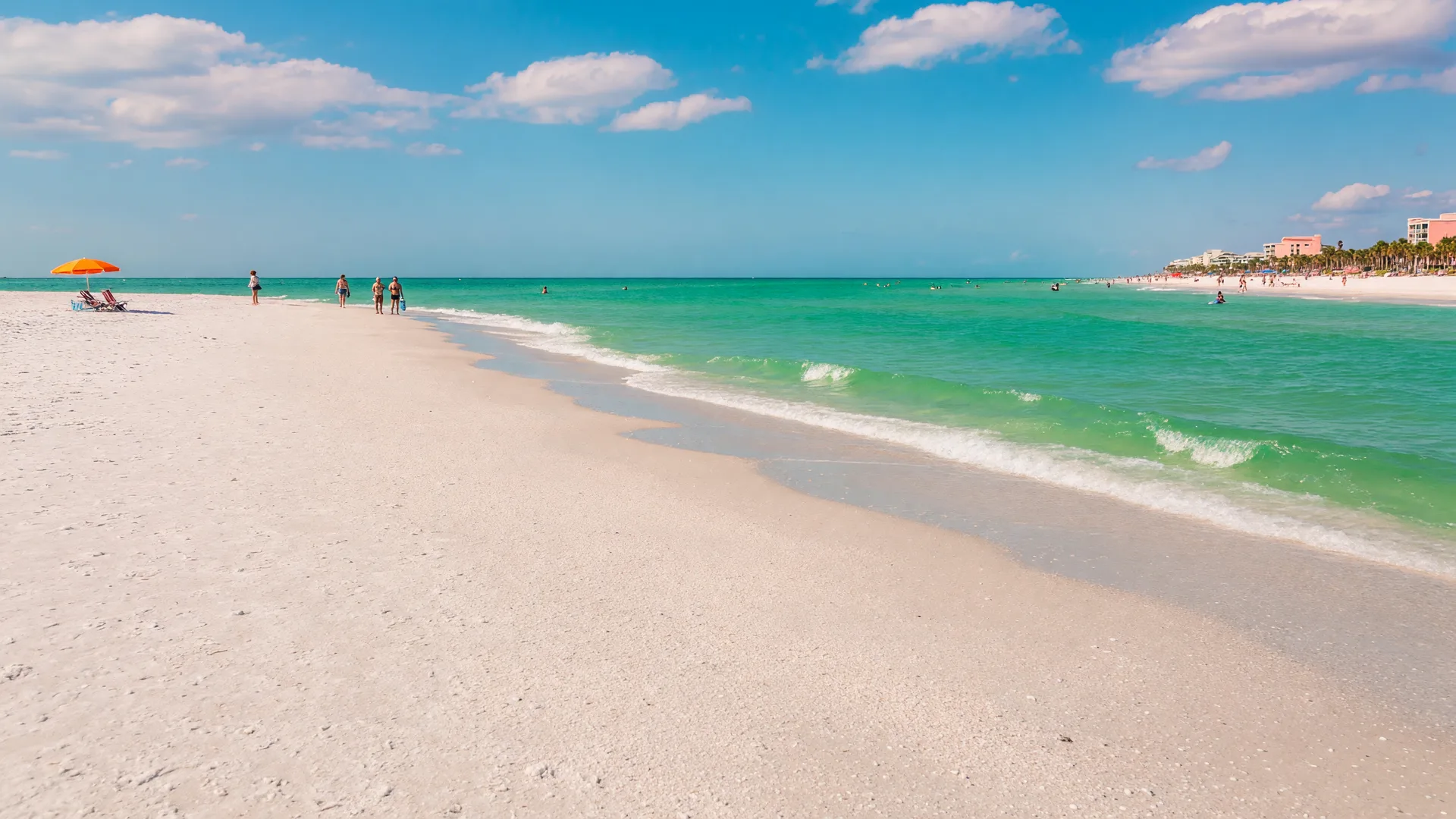 Siesta Key Beach — expansive quartz-crystal white sand stretching toward turquoise Gulf waters, bright blue sky, iconic Florida Gulf Coast shoreline