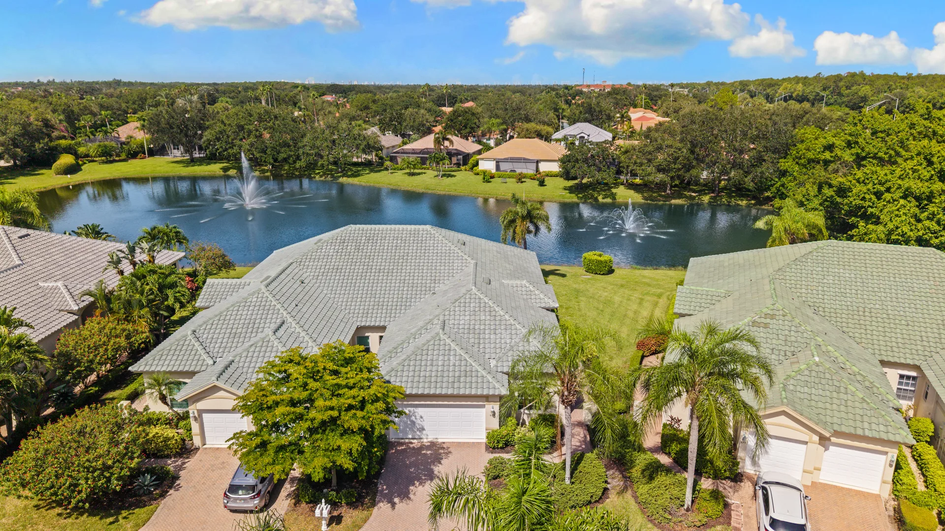 Aerial of neighborhood and lake setting for 878 Vistana Circle Naples Florida