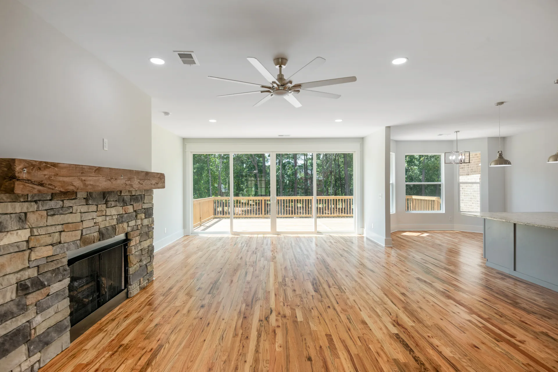 Living room opening into the kitchen and breakfast area