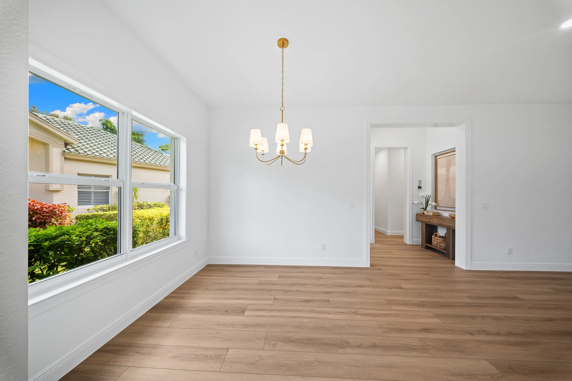 Dining room with gold-finished chandelier