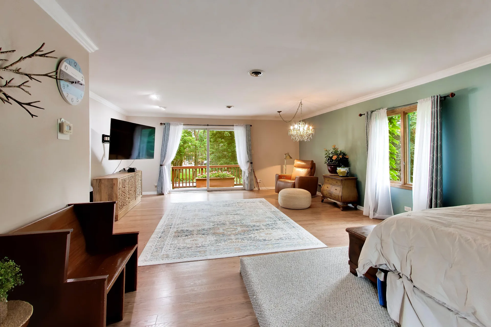 Primary suite at 3708 Cooper Place with a teal accent wall and sliding glass doors