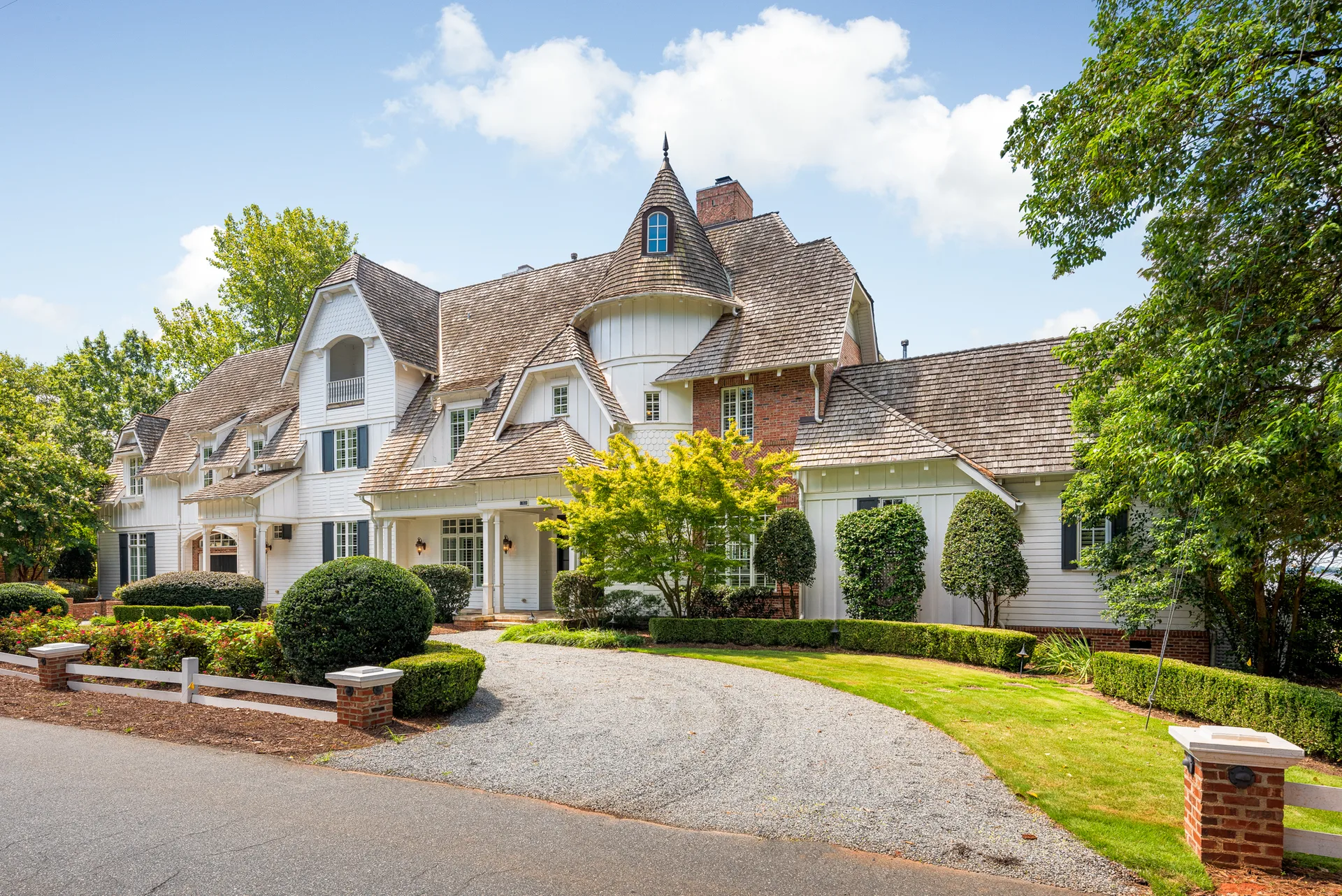 Front facade with driveway and turret feature