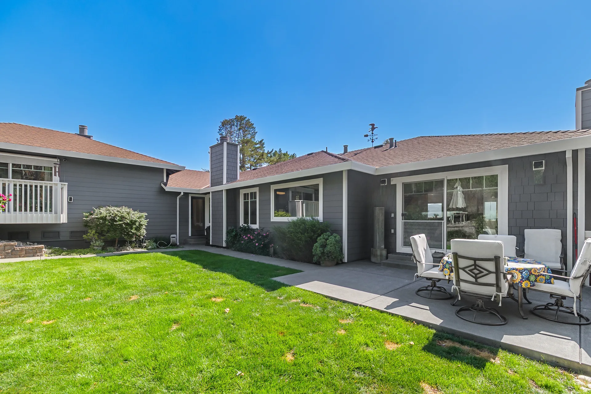 Rear facade with James Hardie Cedarmill siding, patio and lawn