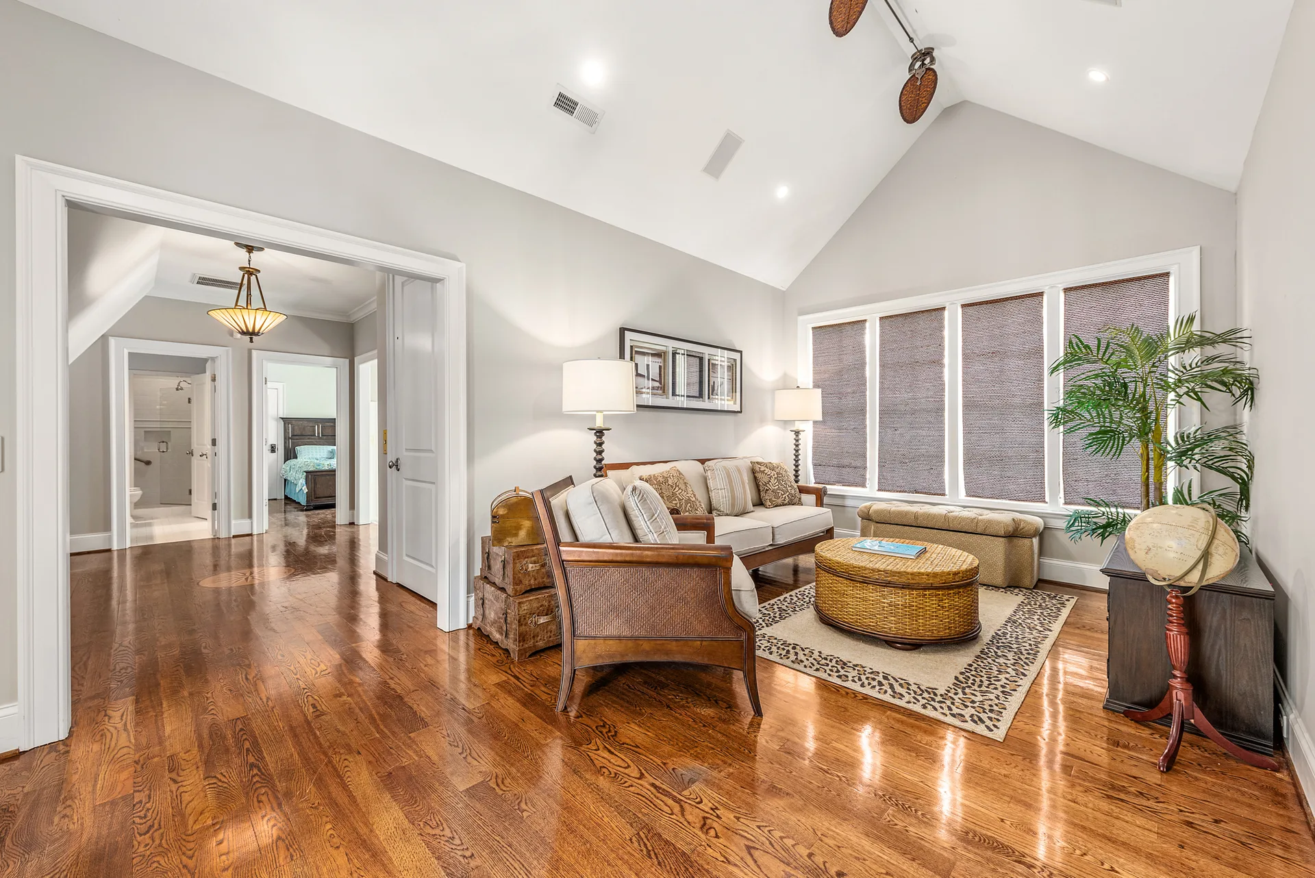Living room with vaulted ceiling and hardwood floors