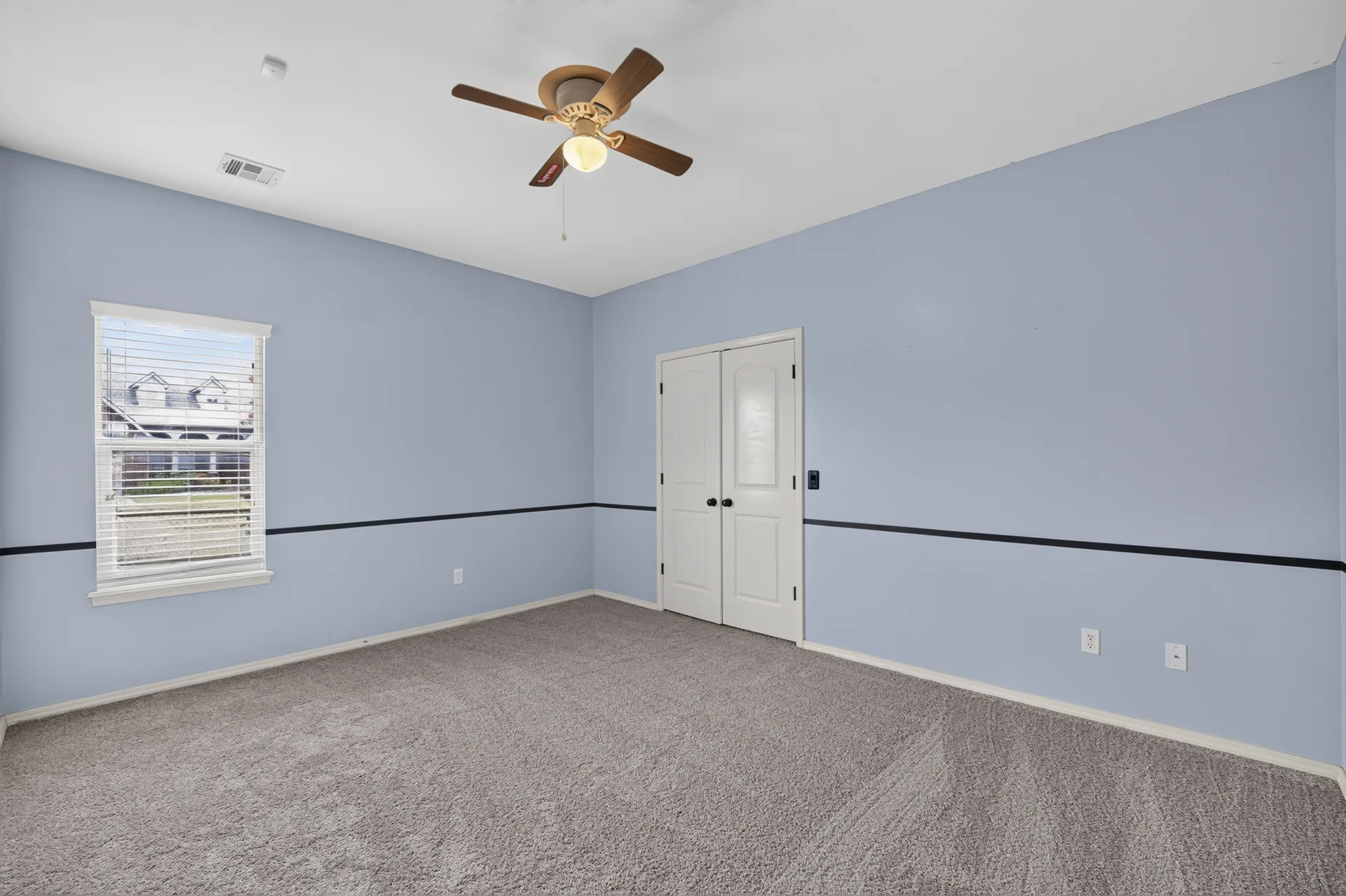 Secondary bedroom with chair rail