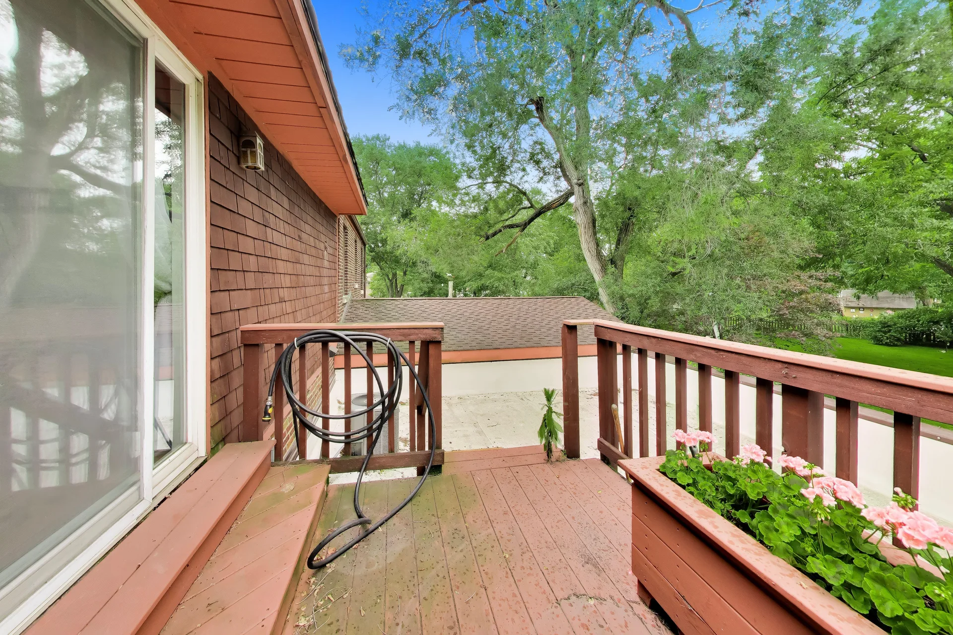 Elevated deck with sliding glass door access
