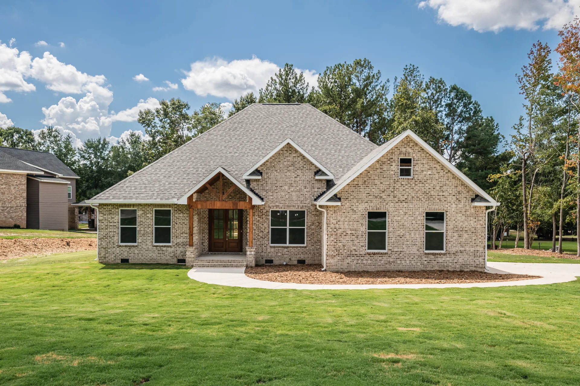Front exterior of new construction brick home at 119 Hastings Point Dr, Columbia SC