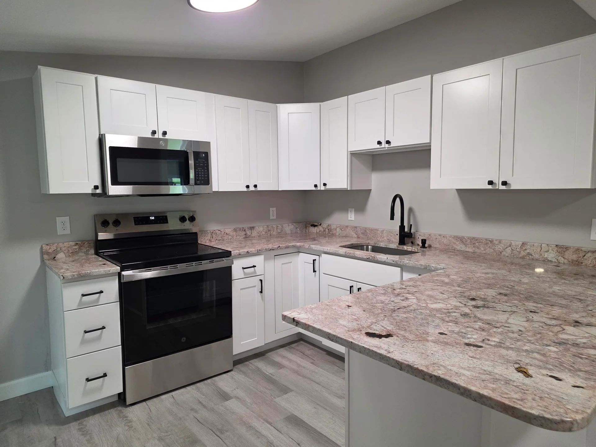 Kitchen with granite countertops and stainless steel appliances