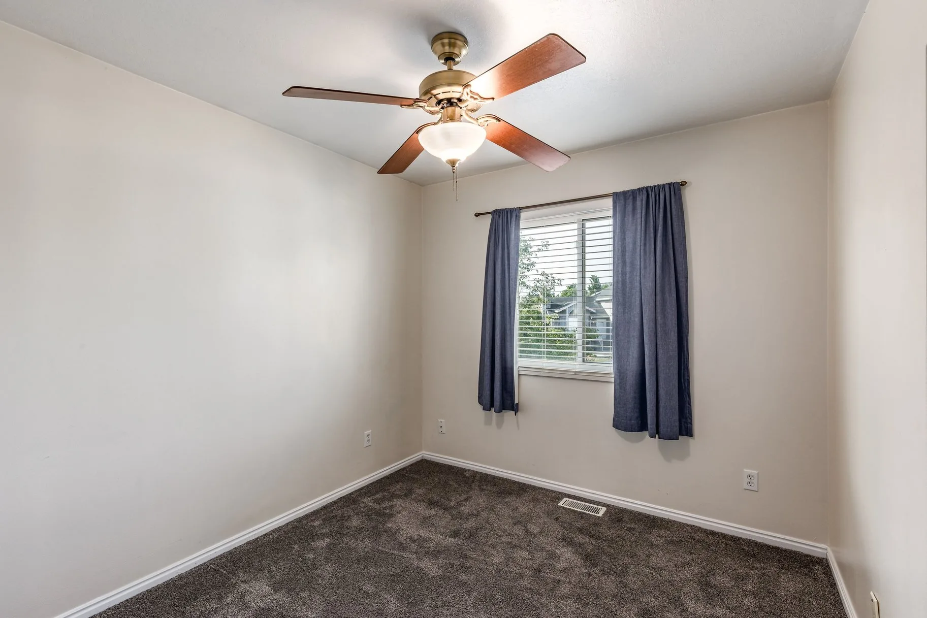 Additional bedroom with neutral finishes