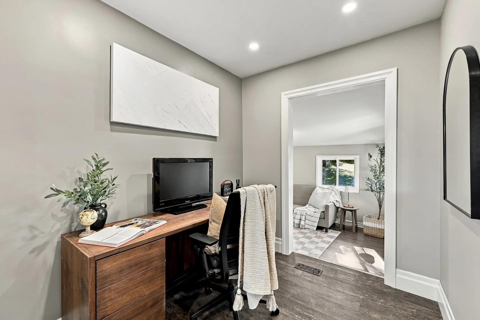 Home office den with desk and arched mirror, ready for Starlink-powered work