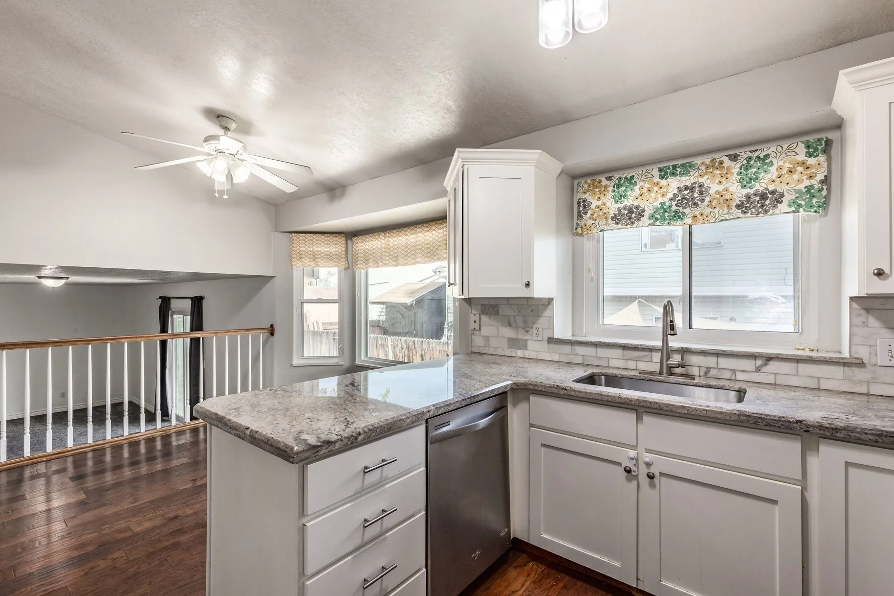 Wide-angle kitchen view with natural daylight