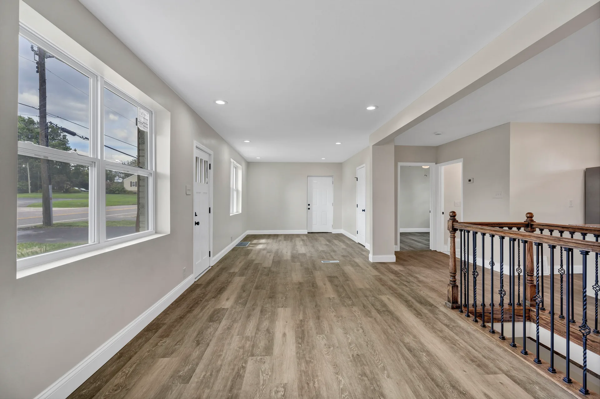 Bright main floor living area with LVP flooring