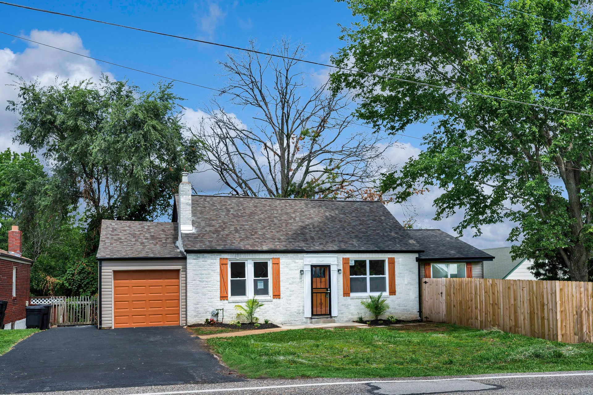 Front exterior view of 9607 Reavis Rd, a freshly rehabbed cottage-style home