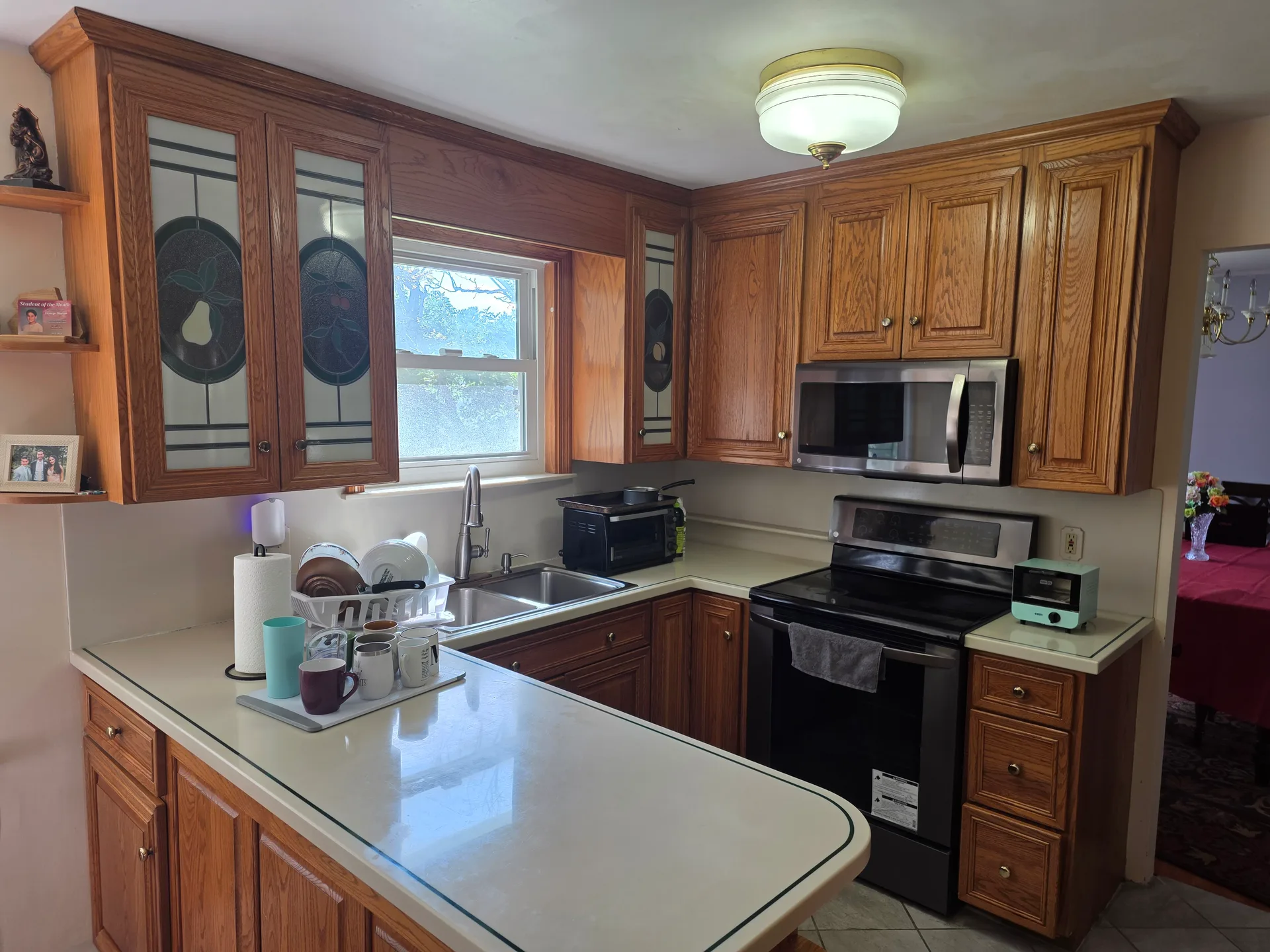 Eat-in kitchen with oak cabinetry and stainless appliances at 4420 Phillip Street