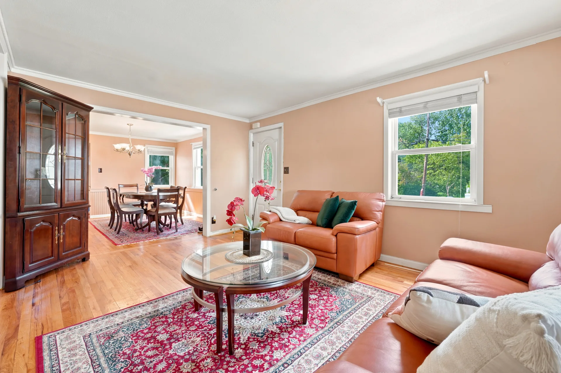 View from the living room into the formal dining room with hardwood floors