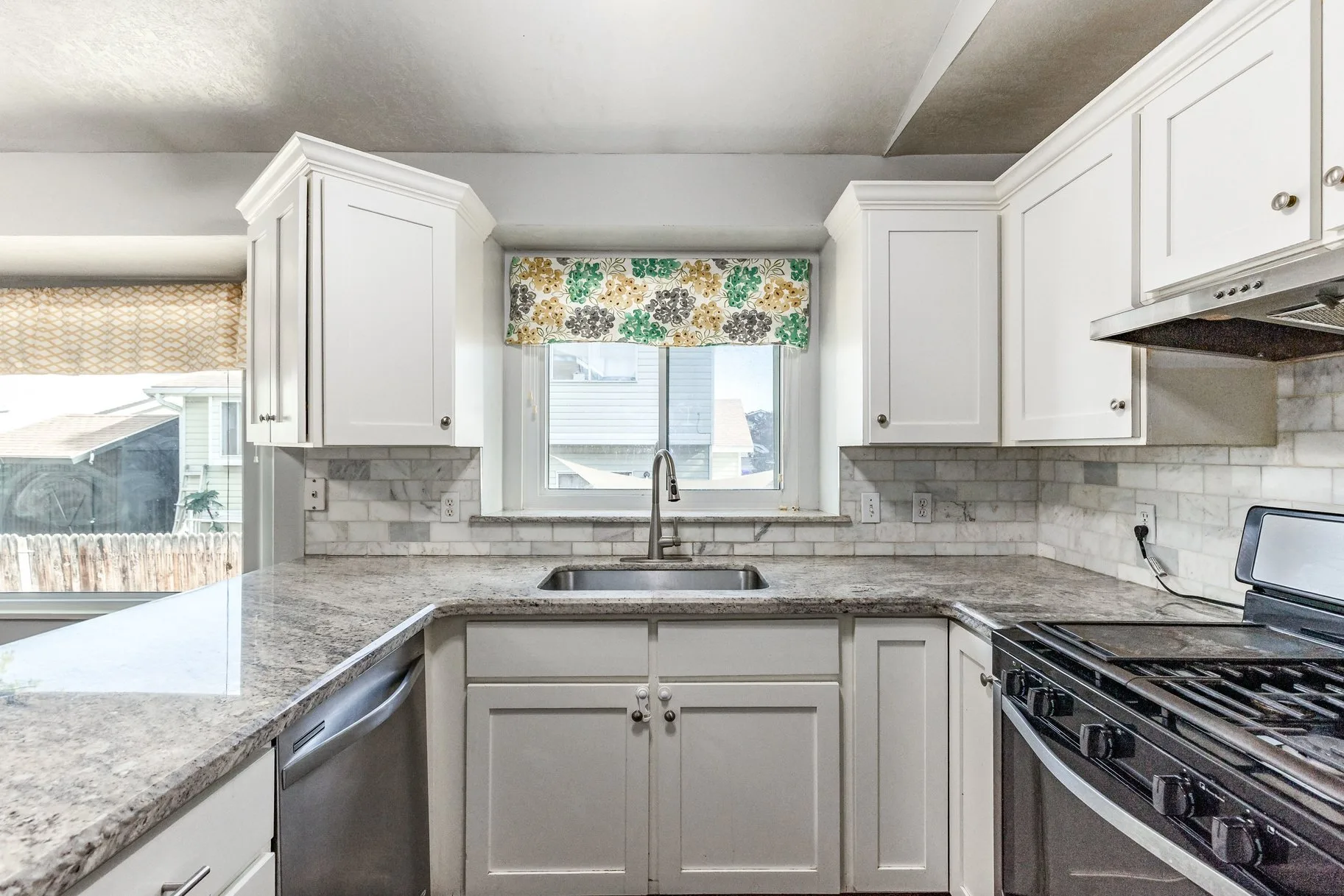 Kitchen countertop detail with marble subway tile