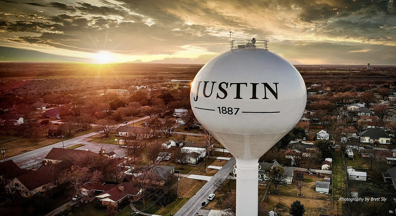 Justin, Texas water tower at sunset.