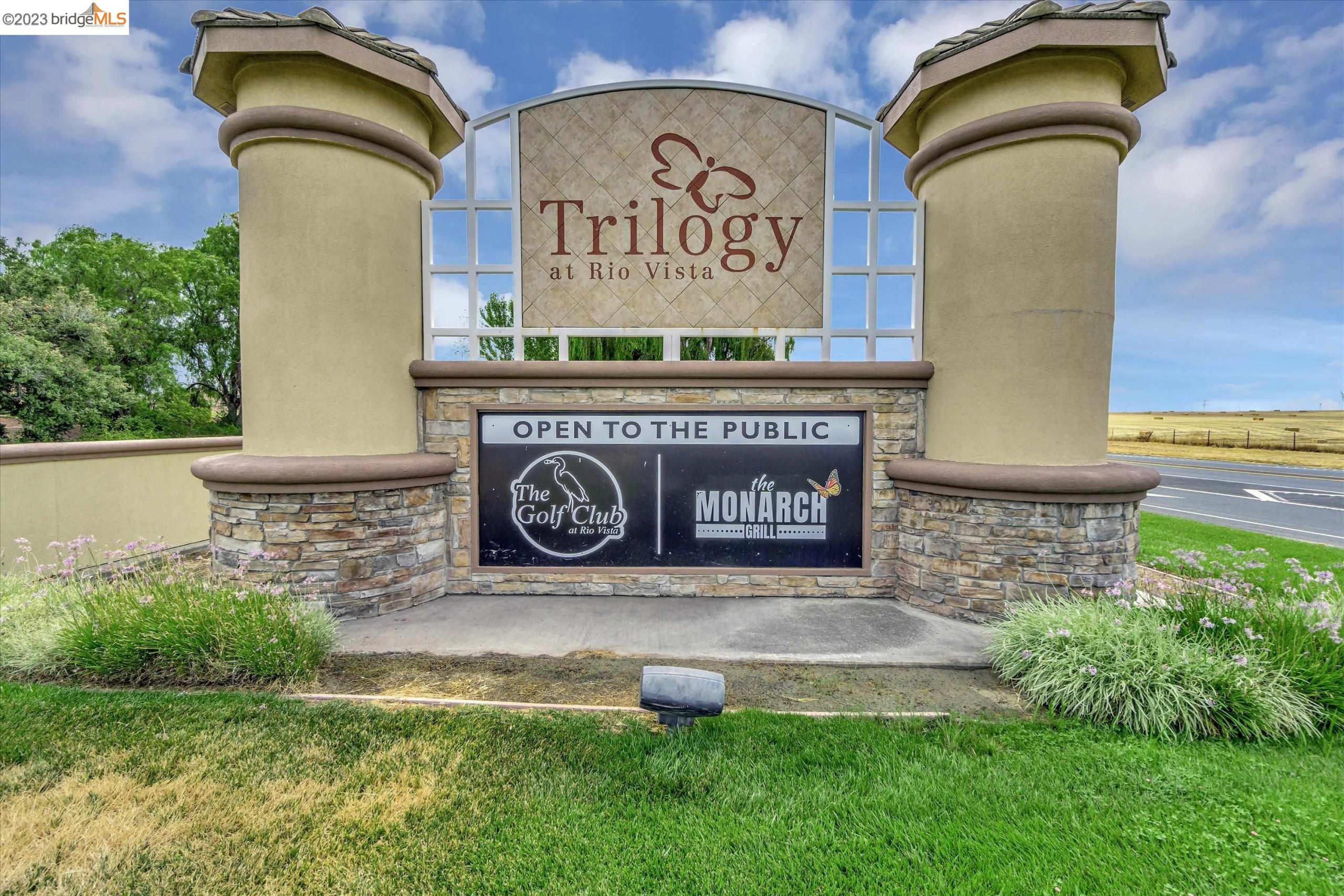 The main road entrance sign at Trilogy Rio Vista, the 55+ active-adult community in Rio Vista, California