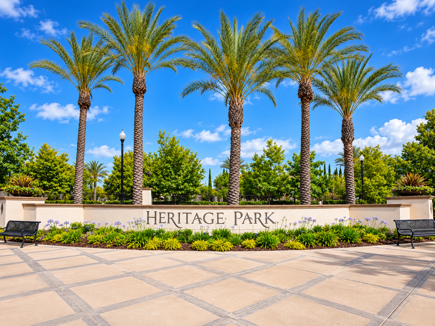 The palm-lined entrance sign at Heritage Park, the gated 55+ active-adult community in Sacramento, California