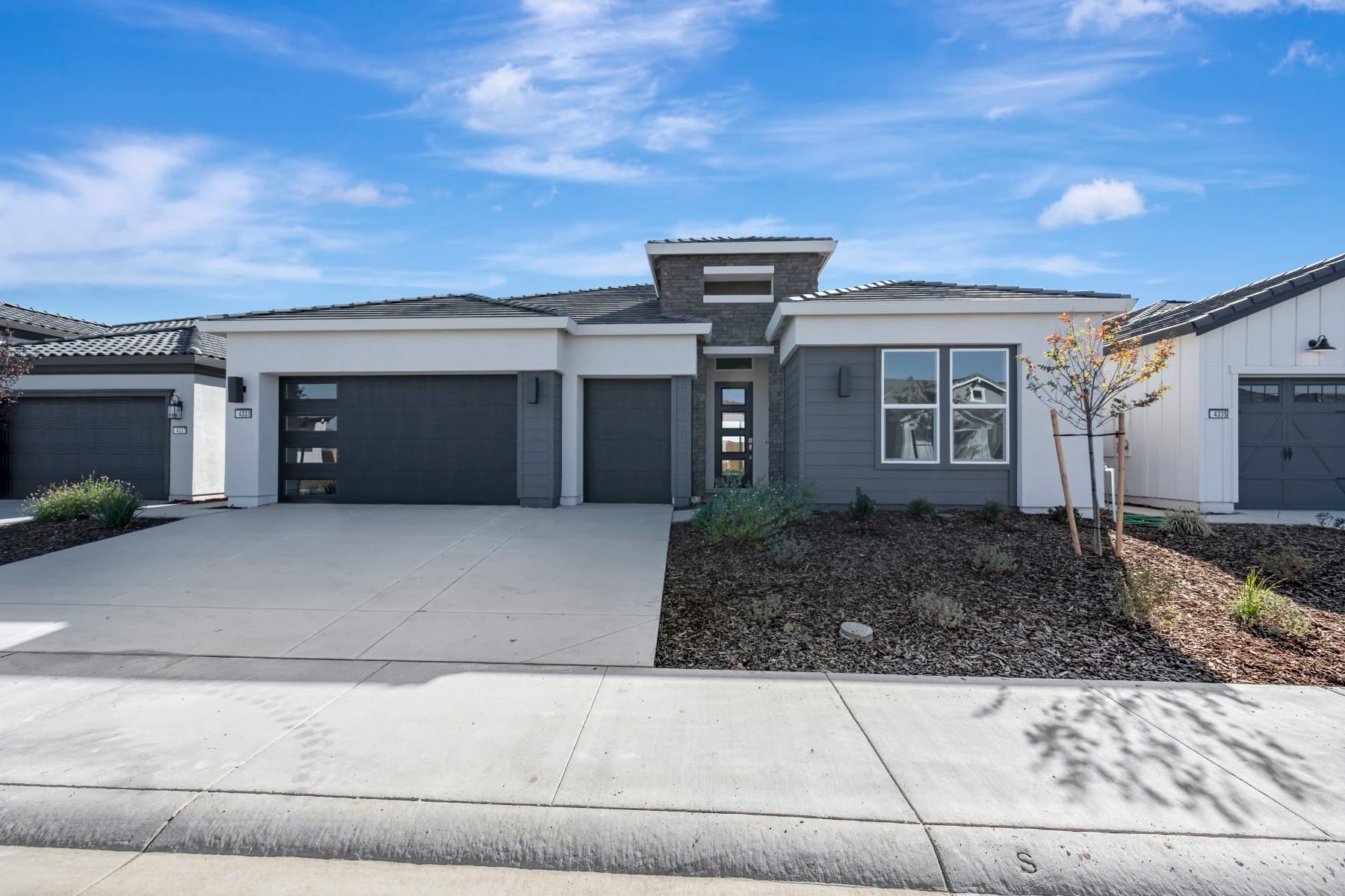 The contemporary exterior elevation, a builder rendering of a Four Seasons at The Ranch home in Rancho Cordova, California